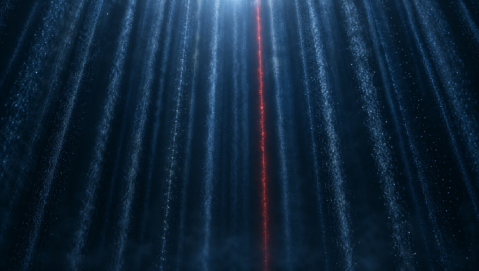 Disciplined vertical streams of blue particles flowing downward, with one steady red stream among them.
